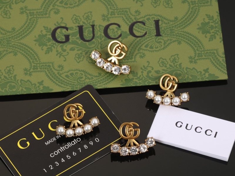 G*u*i earrings